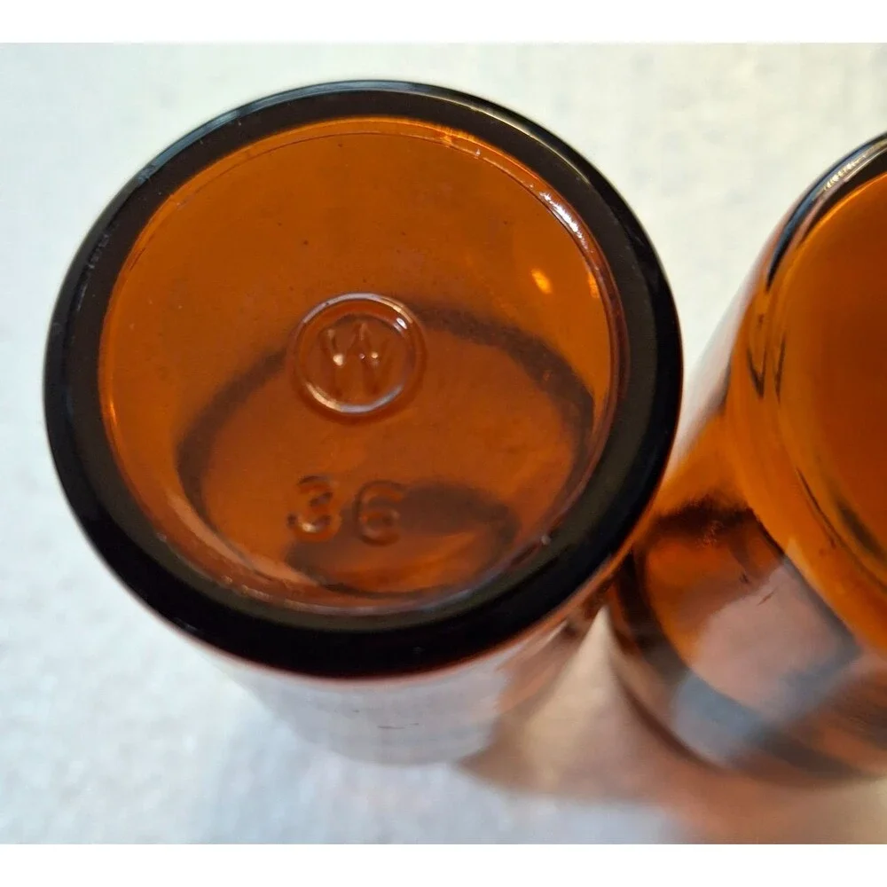 2 W Encircled Amber Glass Bottles 3 3/8